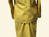 yellow jacket on a mannequin on a stand with a white background