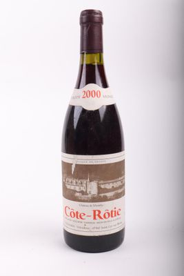 a bottle of wine that is sitting on a table