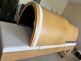 a bed with a wooden frame and a white mattress