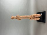 an image of a sculpture of a person holding a piece of wood
