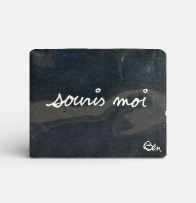 a picture of a black business card holder with the word louis mou written on it