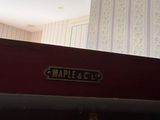 a red suitcase sitting on top of a shelf in a room