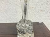 an image of a glass candle holder on top of a wooden table