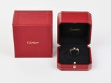 a red box with a ring inside of it on a white surface
