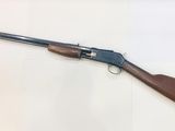 a rifle that is laying on top of a table