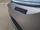 a close up of a car ' s bumper with a sticker on it