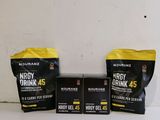 three bags of energy drink on a table next to a bag of energy drink
