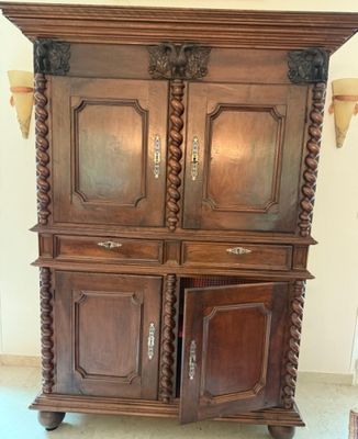 a large wooden cabinet with a door and a door handle