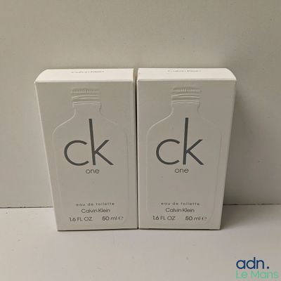 two boxes of calvin calvin one cologne sitting on a table