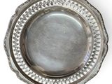 a silver plate on a white background with a white background