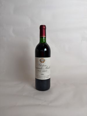 a bottle of wine that is sitting on a table