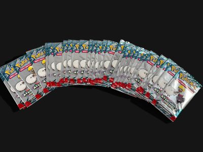 several packs of pokemon trading cards are stacked on top of each other
