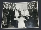a black and white photo of a group of people posing for a picture