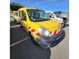 a yellow van that is parked in a parking lot