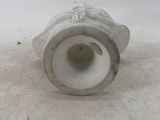 a white vase with a handle on a white surface
