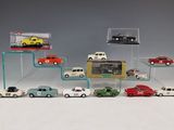 a lot of toy cars that are in a display case