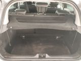 a trunk of a car with the back seats folded down