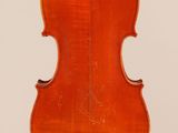 an old violin with a wooden back and a long neck