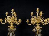 pair of antique french bronze figurines of a boy and a girl holding a candelabra