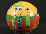 an image of a colorful ball with people painted on it