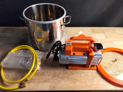 a bucket and a hose on a cutting board