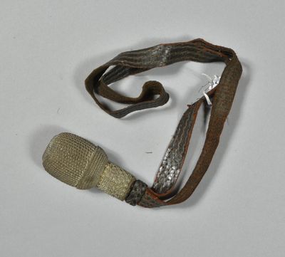 a small piece of cloth and a small piece of wood