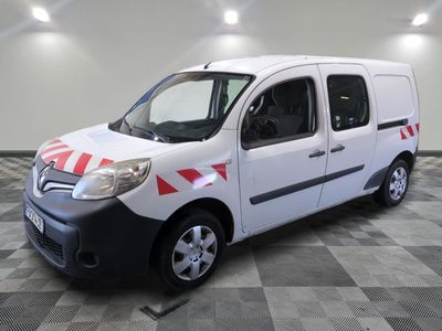 a white van with red and white stripes parked in a room