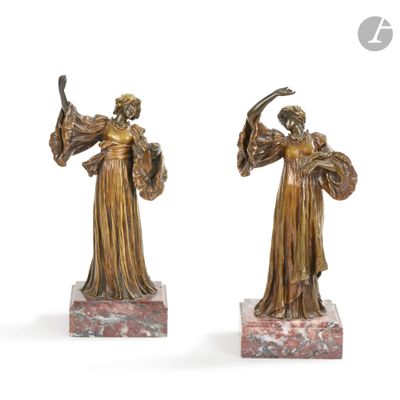 pair of bronze figurines of a woman holding a fan and a bird