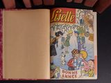 someone is holding a book with a picture of a cartoon character on it