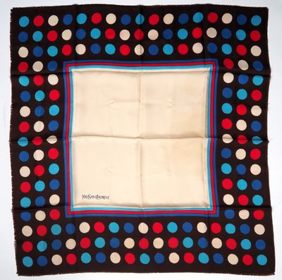 a close up of a square scarf with polka dots on it