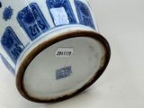 a blue and white vase sitting on a table