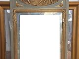a mirror that is sitting on the floor in front of a mirror