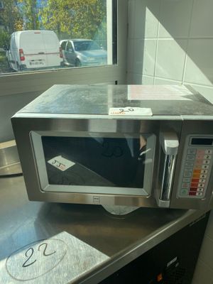 a microwave sitting on top of a counter in a kitchen