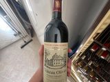 a person holding a bottle of wine in their hand