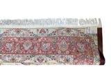 rug with fringes on top of it on a white background