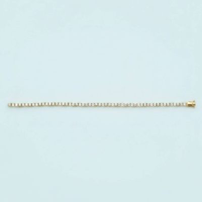a gold chain on a white background