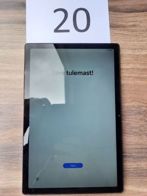 an image of a tablet computer sitting on top of a wooden table