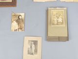 many old photos on the wall of this room