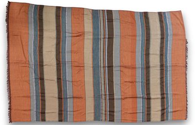 an orange, blue and brown striped blanket with fringes