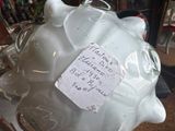 a piggy bank with a note attached to it