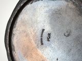 a black and white photo of a cast iron skillet