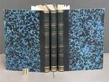 two books that are open on a table
