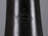 a close up of a black vase with a white background