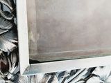 a picture of a silver plate with flowers and leaves on it