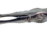 a silver spoon with a handle that has flowers on it