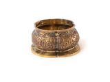 a close up of a gold ring on a white background