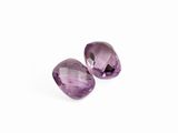 a pair of purple amethtites on a white background