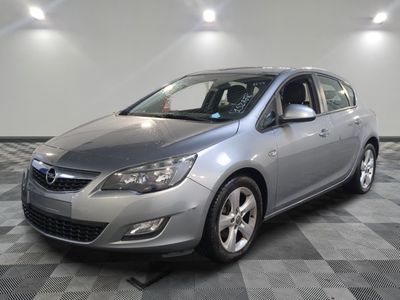 a picture of a silver car parked in a garage