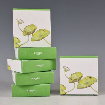three boxes of soap sitting on top of each other on a table