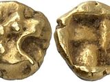 a gold coin with an image of a woman on it